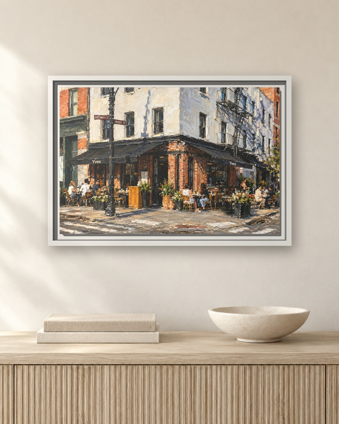 Yves Cafe framed canvas print hanging above a sideboard