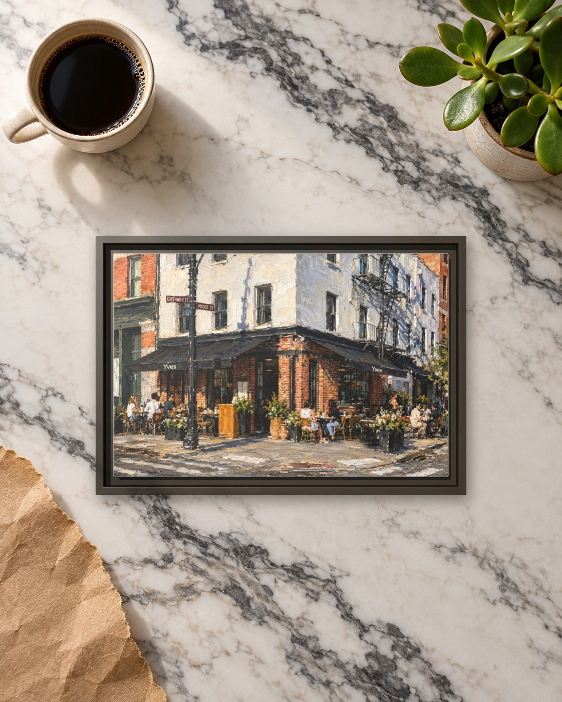 Yves Cafe framed canvas print lying on a table